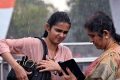 People brave through rains near Kartavya Path, in New Delhi.