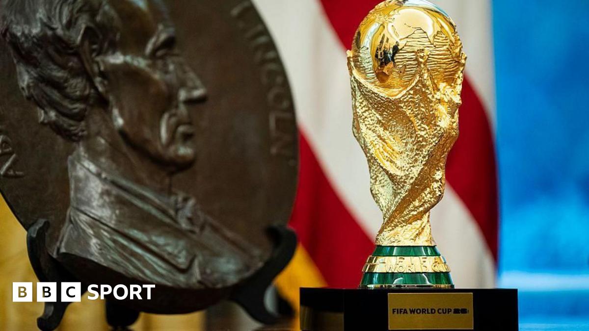 The World Cup trophy on display with a carving of 16th US President Abraham Lincoln.