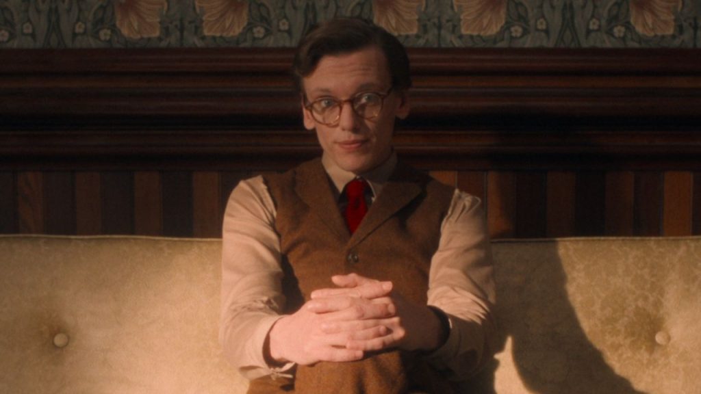 Mr. Whatsit sitting on couch in midscape in Stranger Things Season 5