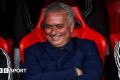 Jose Mourinho smiles and folds his arms