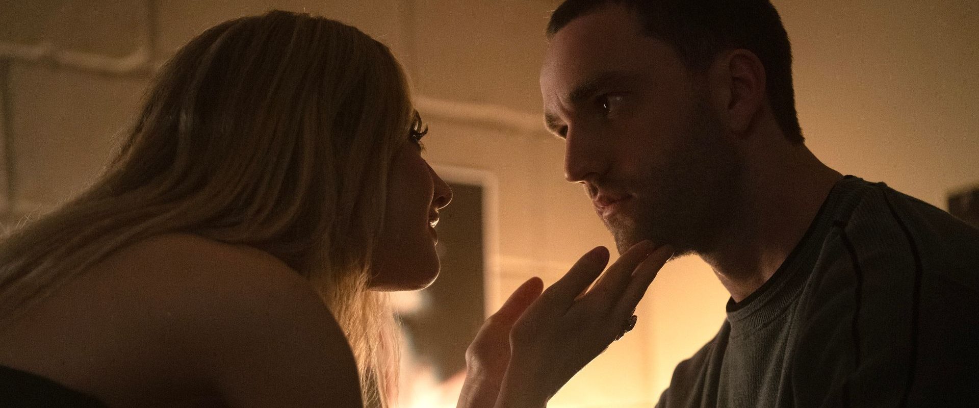 Lucy holds Stephen's chin in her hands in Tell Me Lies season 3