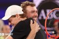 Amateur player Jordan Smith hugs Australian Open champion Jannik Sinner after beating him in the One Point Slam