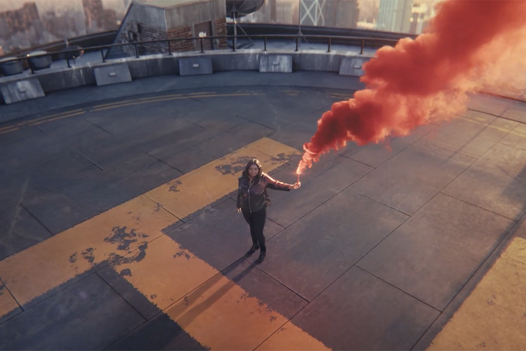Octavia Spencer standing on a roof with a smoke flare