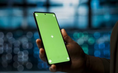 close-up-data-center-system-administrator-using-green-screen-smartphone-optimize-network-scaled.jpg