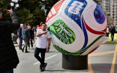 A fan snaps a photo alongside a giant soccer ball display outside the B.C. legislature in March. Nelson will host a FIFA event on June 24 at Lakeside Park. (Tony Trozzo/Victoria News)